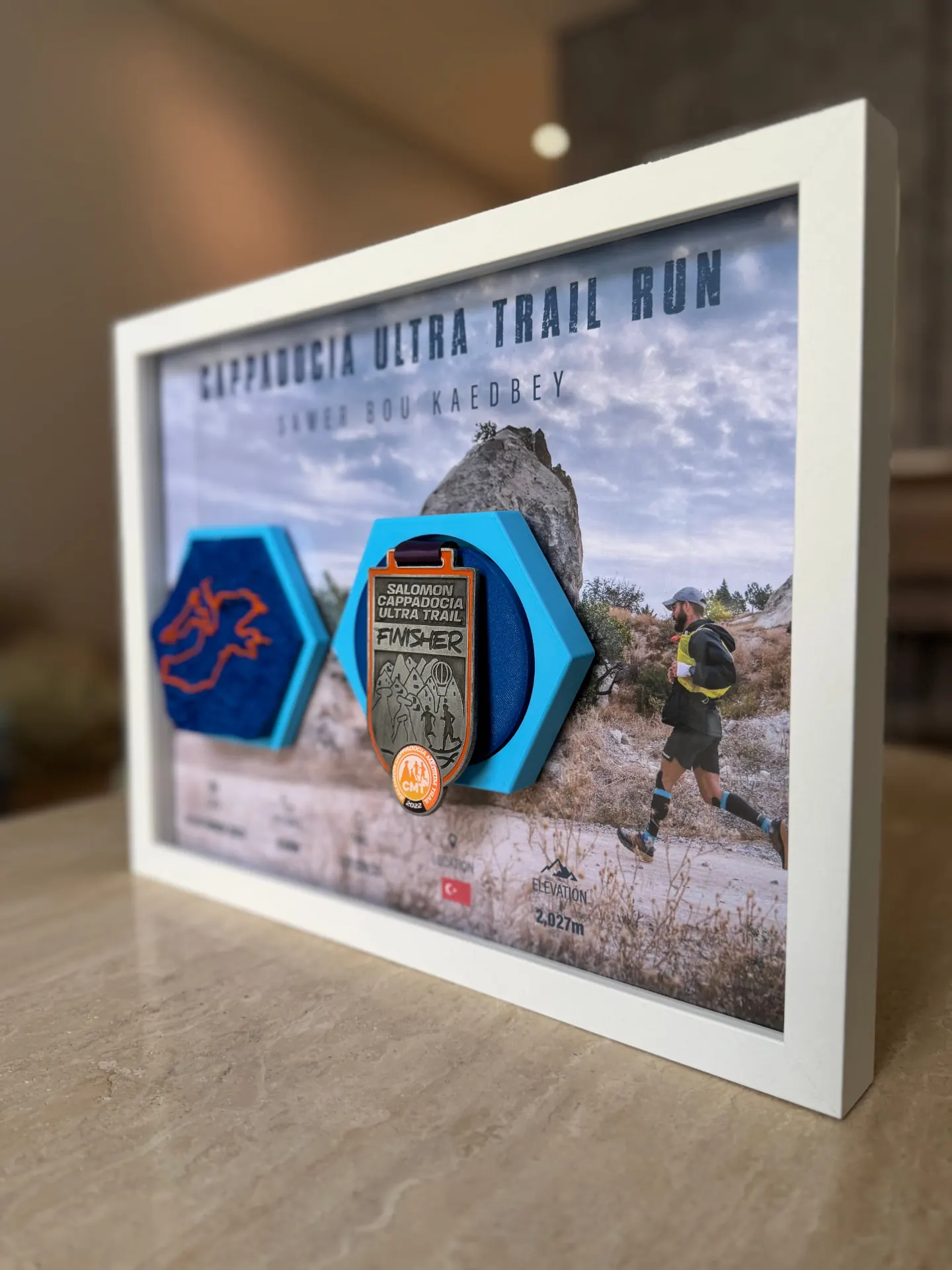 Cappadocia Ultra Trail Run — Medal Detail — Salomon Cappadocia finisher medal mounted on the hex.
