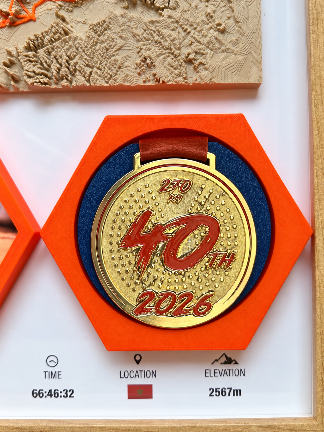 MDS Legendary 40th — Medal Hex — 40th anniversary finisher medal set in an orange hex mount.